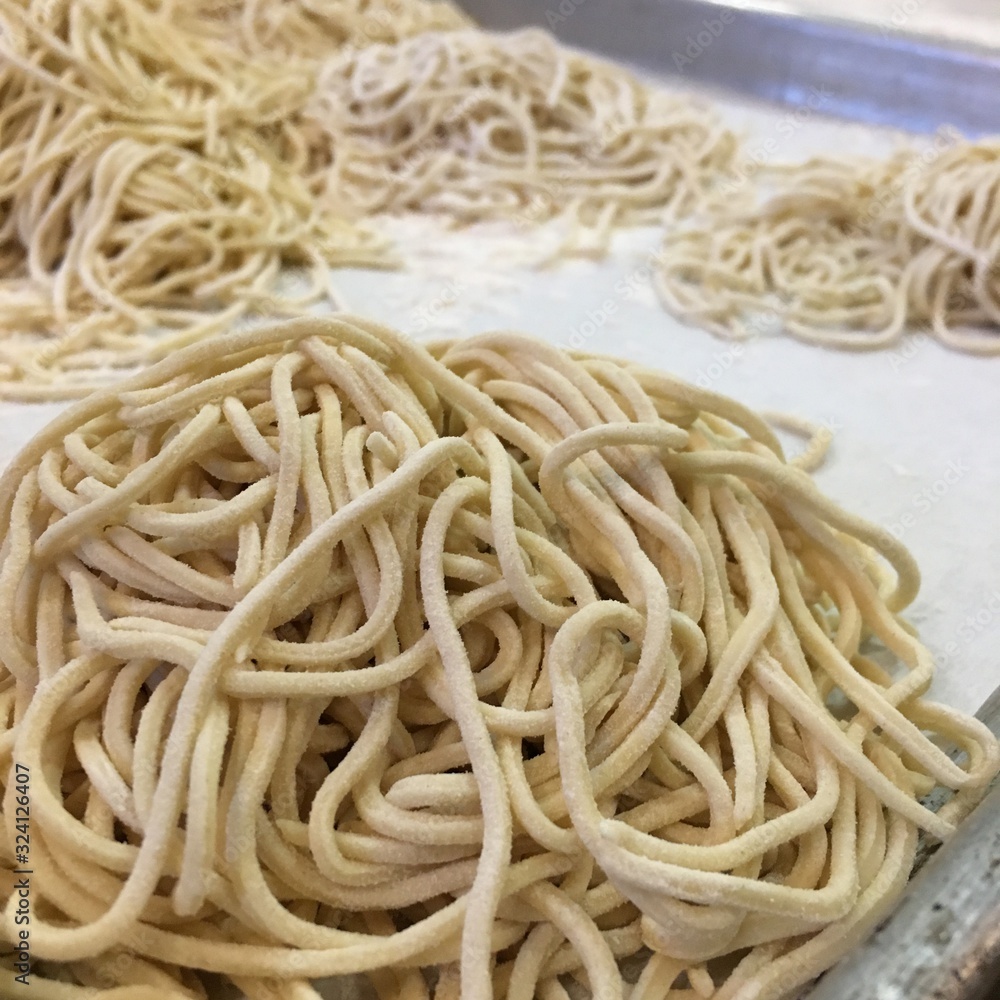 fresh pasta noodles isolated on white background