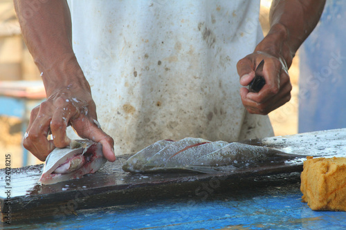 Butchering fish at the market