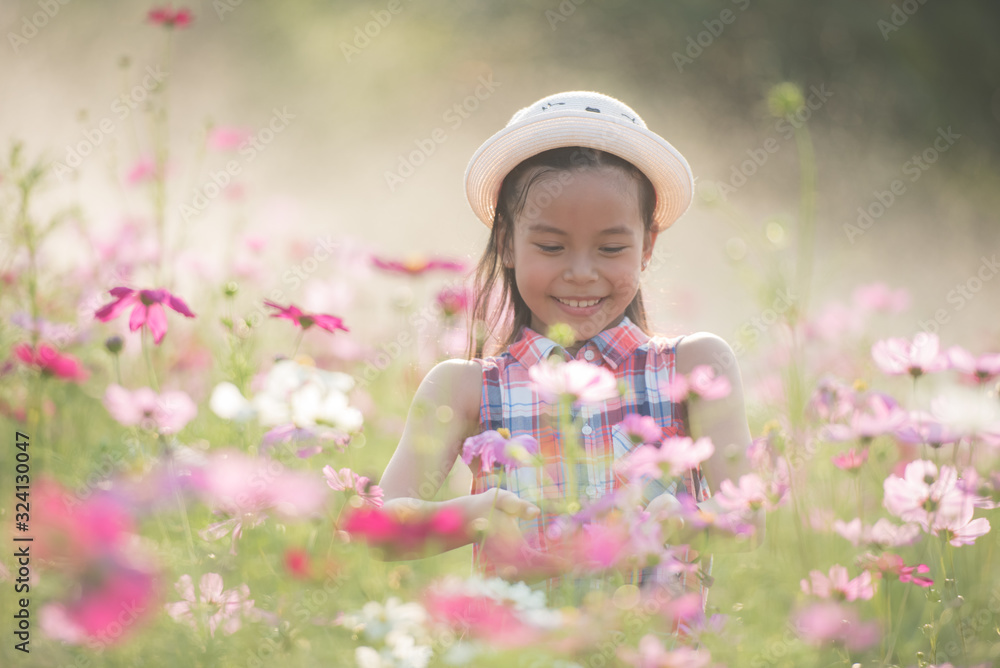 traveler or tourism. happy little asian girl child in cosmos flower fields with big smile and laughing healthy happy funny smiling face young adorable lovely female kid. happy lifestyle concept. traveler or tourism. happy little asian girl child in cosmos flower fields with big smile and laughing healthy happy funny smiling face young adorable lovely female kid. happy lifestyle concept.