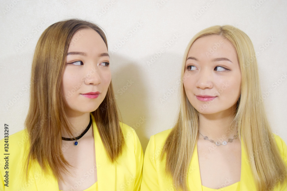 asian twins looking into each other eyes asian twins looking into each other eyes