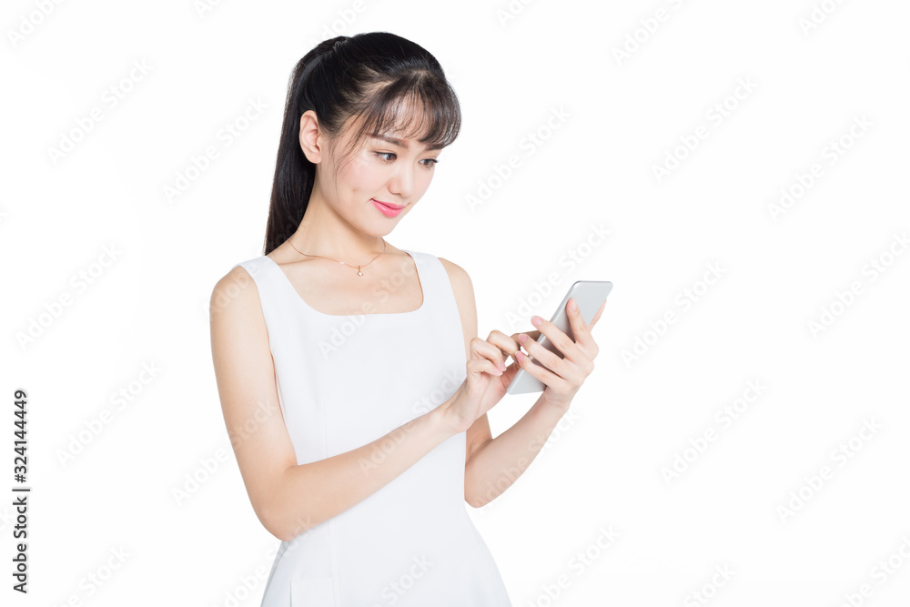 young woman wearing white dress using smartphone against white background young woman wearing white dress using smartphone against white background