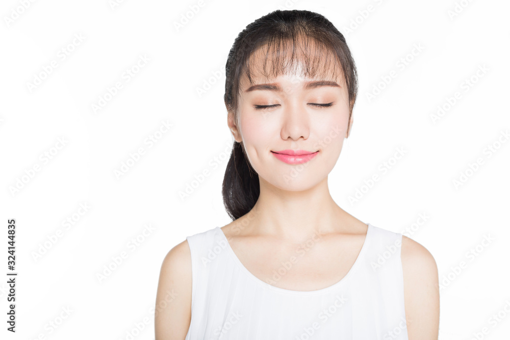 young woman smiling with eyes closed,studio shot. young woman smiling with eyes closed,studio shot.
