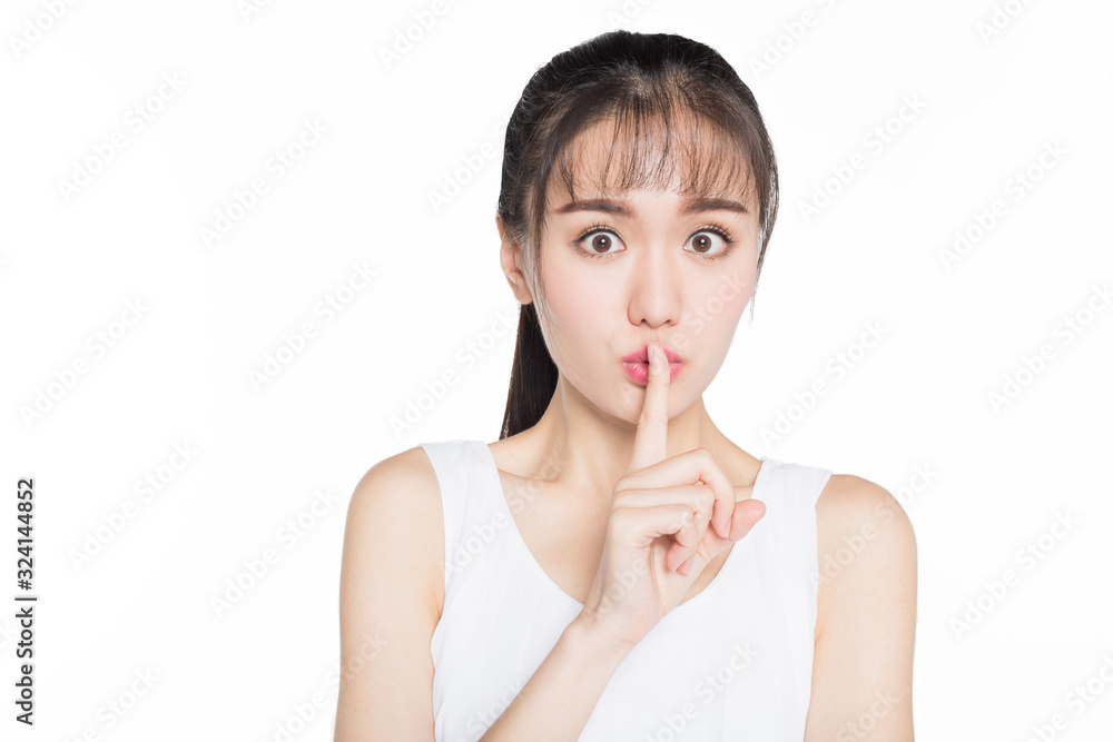 shocked woman with finger on her lips. shocked woman with finger on her lips.