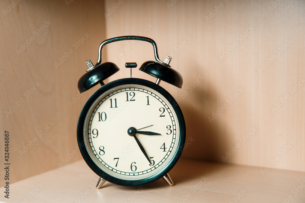 Retro alarm clock in black. Retro alarm clock in black.