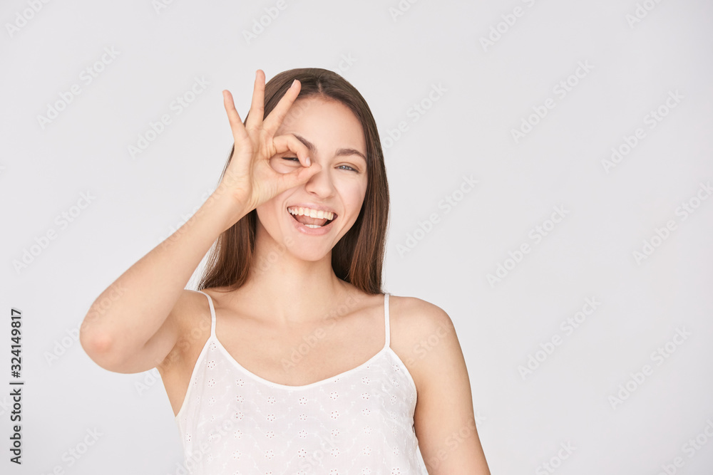 Young beauty girl sign ok. Zero gesture woman smile portrait. Female people hand Young beauty girl sign ok. Zero gesture woman smile portrait. Female people hand