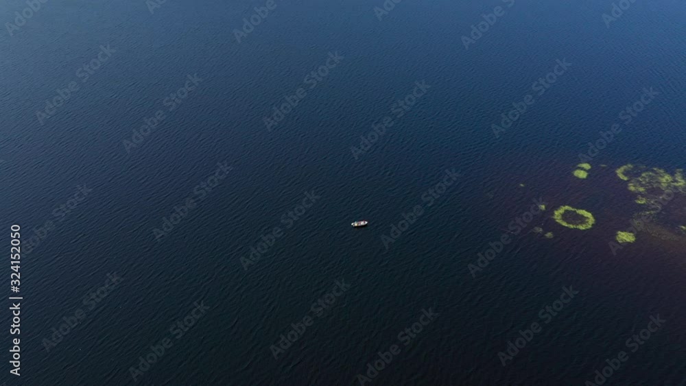 Boat relaxing on lake in Notre Dame du Laus, Quebec. Aerial View Boat relaxing on lake in Notre Dame du Laus, Quebec. Aerial View