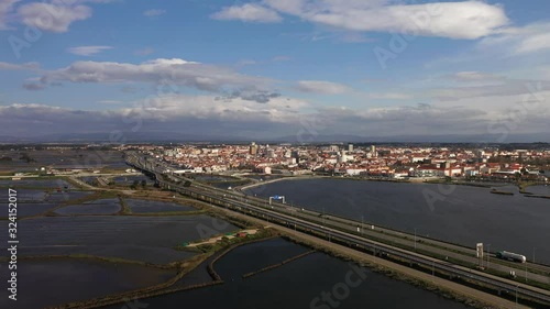 Parallax aerial drone view of Aveiro city center, beautiful lagoon and the bridge.