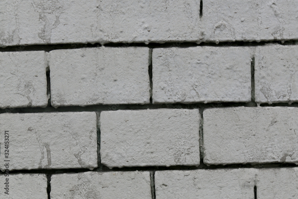 Obraz premium gray rough painted brick wall abstract background