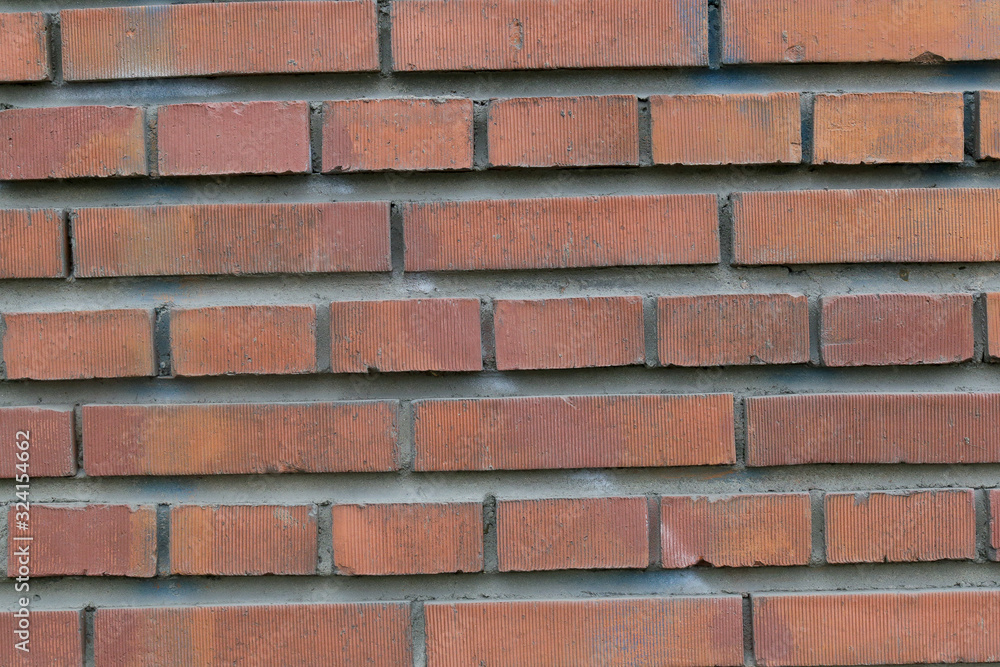 Obraz premium red rough brick wall abstract background