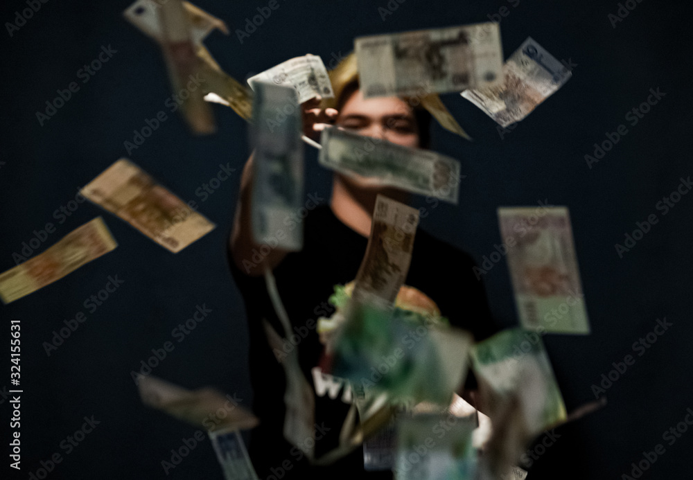 Floating money, man throws money, man with money in hands Floating money, man throws money, man with money in hands