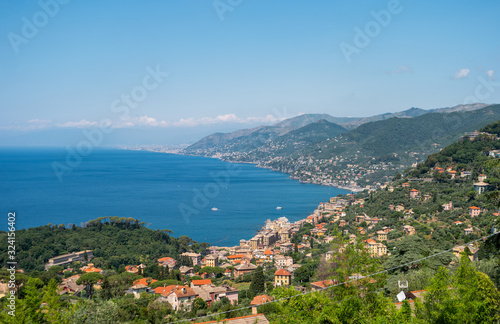 Beautiful panoramic view of the city of Camogli, located on the shores of the Ligurian Sea. Traditional Italian houses stretch along the coastline.