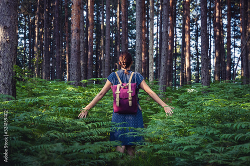 Fototapeta Naklejka Na Ścianę i Meble -  Woman in forest in vacation.