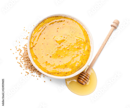 Fotografie Bowl of tasty honey mustard sauce on white background