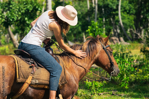 Horse ride through jungle in vacation.