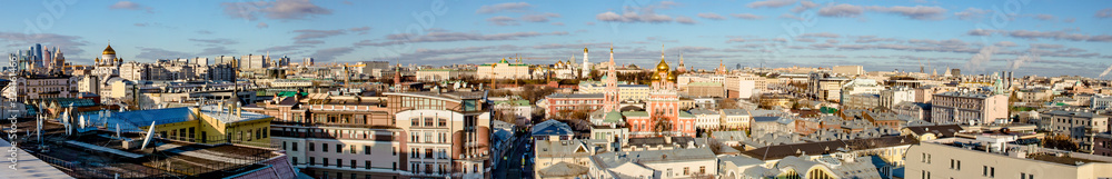 Panoramic view of the center of Moscow streets and houses from a bird's flight on a clear winter day