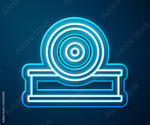 Glowing neon line Otolaryngological head reflector icon isolated on blue background. Equipment for inspection the patient's ear, throat and nose. Vector Illustration