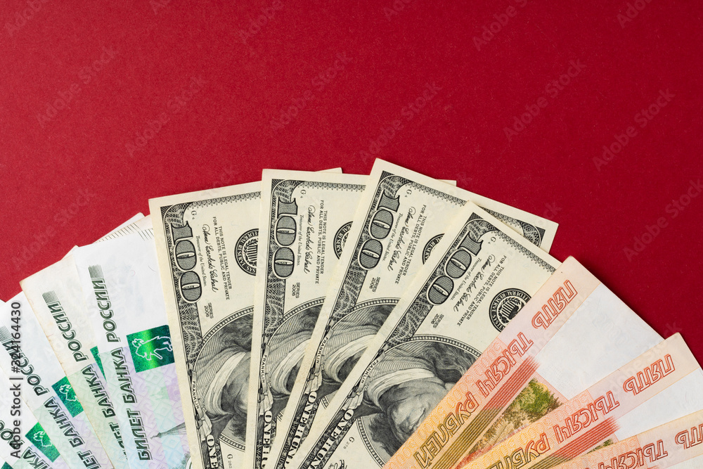 US Dollar and Russian Ruble banknotes close up US Dollar and Russian Ruble banknotes close up