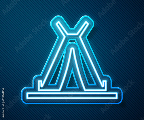 Glowing neon line Traditional indian teepee or wigwam icon isolated on blue background. Indian tent. Vector Illustration