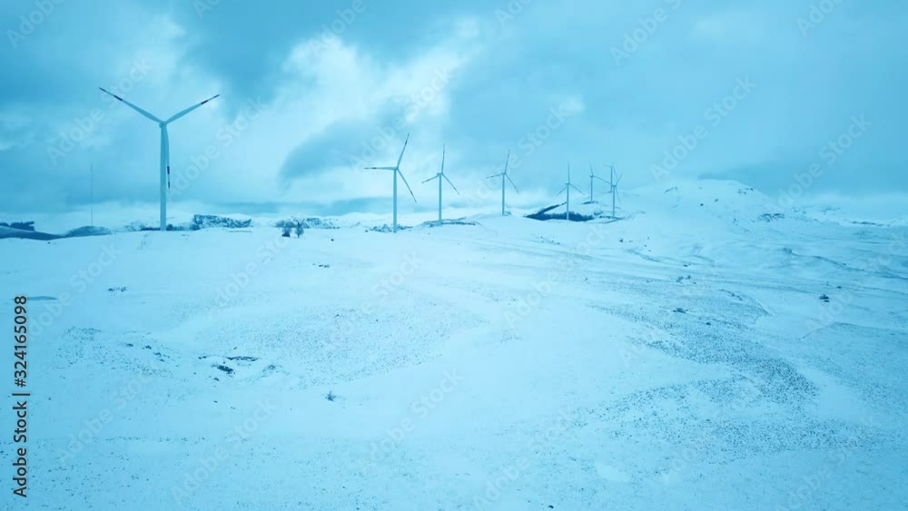 Green Energy Wind Turbines at Krnovo Montenegro. Snow Covers Landscape Around Wind Turbines. Kinetic Energy of Wind. Wind Farm In Clouds. Krnovo Vjetroelektrane Green Energy Wind Turbines at Krnovo Montenegro. Snow Covers Landscape Around Wind Turbines. Kinetic Energy of Wind. Wind Farm In Clouds. Krnovo Vjetroelektrane