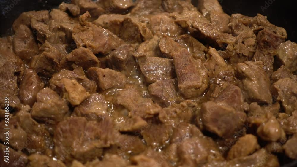 Preparation of beef in cast iron pan. Preparation of beef in cast iron pan.