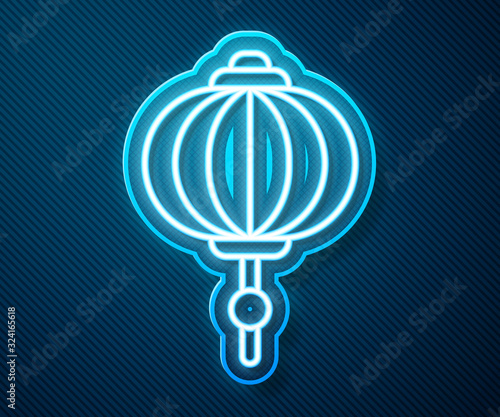 Glowing neon line Chinese paper lantern icon isolated on blue background. Vector Illustration