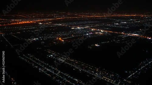 A view looking down on the city from the air at night plane thailand,There is little noise