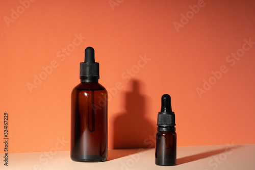 Cosmetic aromatic spa oil in brown glass bottle