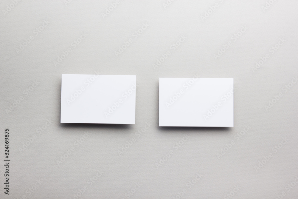 Business card blank on wooden background. Corporate Stationery, Branding Mock-up. Creative designer desk. Flat lay. Copy space for text Business card blank on wooden background. Corporate Stationery, Branding Mock-up. Creative designer desk. Flat lay. Copy space for text