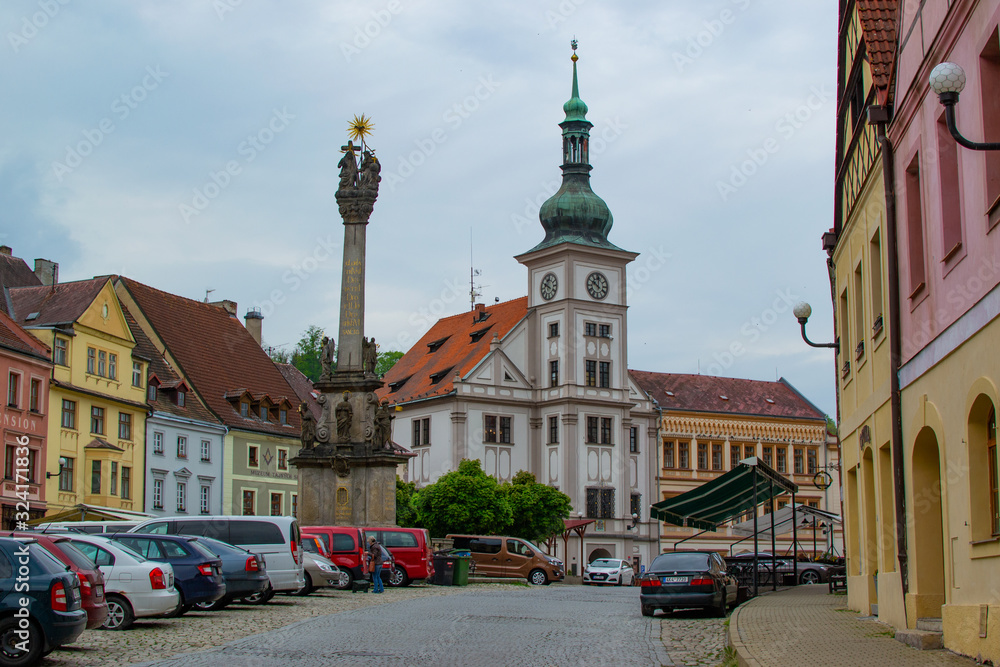 Loket, Czech Republic; 5/19/2019: Loket Market (or main square of Loket), with the Holy Trinity Column on the left and the Town Hall at the background