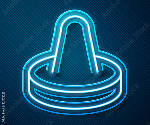 Glowing neon line Mallet and puck for playing air hockey game icon isolated on blue background. Vector Illustration