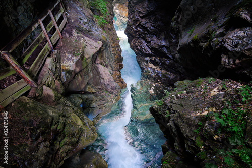 Waterfalls Stanghe (Gilfenklamm) localed near Racines, Bolzano in South Tyrol, Italy. Wooden bridges and runways lead through the canyon and give a spectacular sight to the waterfalls.