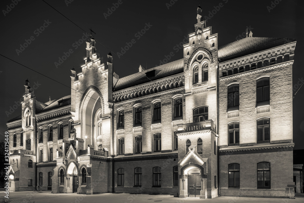 Modern city architecture. Night lighting of building in art Nouveau style. Riga, Latvia.