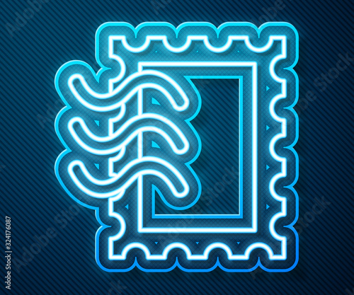 Glowing neon line Postal stamp icon isolated on blue background. Vector Illustration