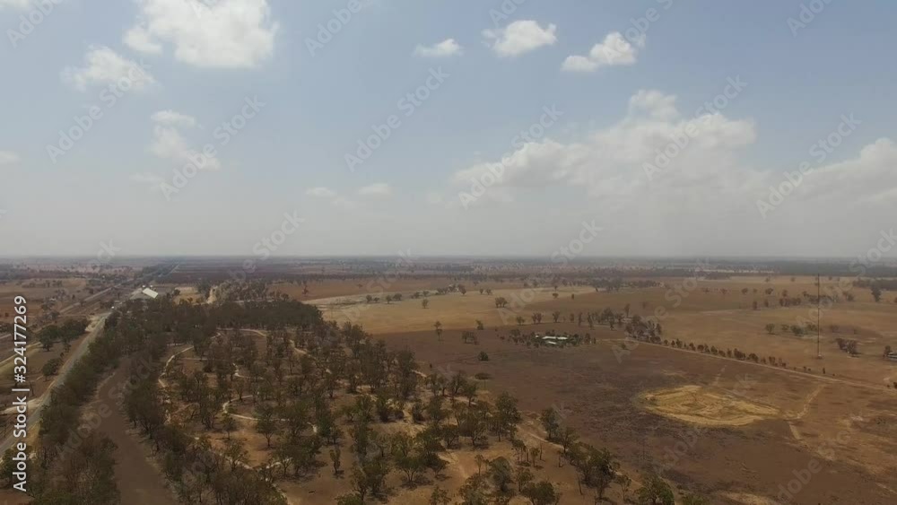 Aerial over the landscape of trees growing in the harsh and arid environment of Outback Australia Aerial over the landscape of trees growing in the harsh and arid environment of Outback Australia