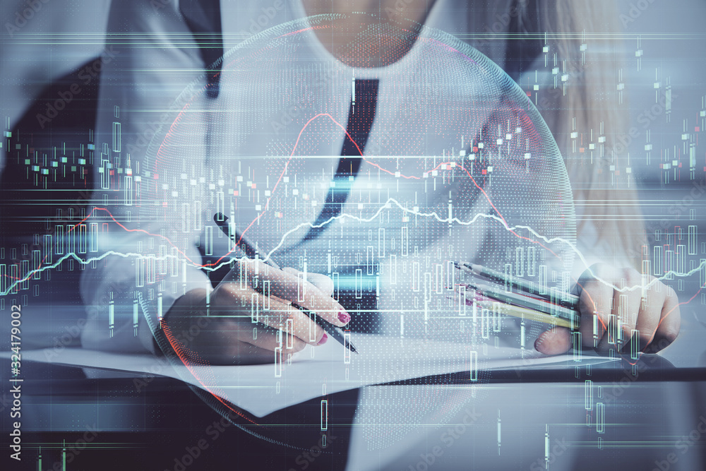 Double exposure of hands making notes with forex chart huds. Stock market concept. Double exposure of hands making notes with forex chart huds. Stock market concept.