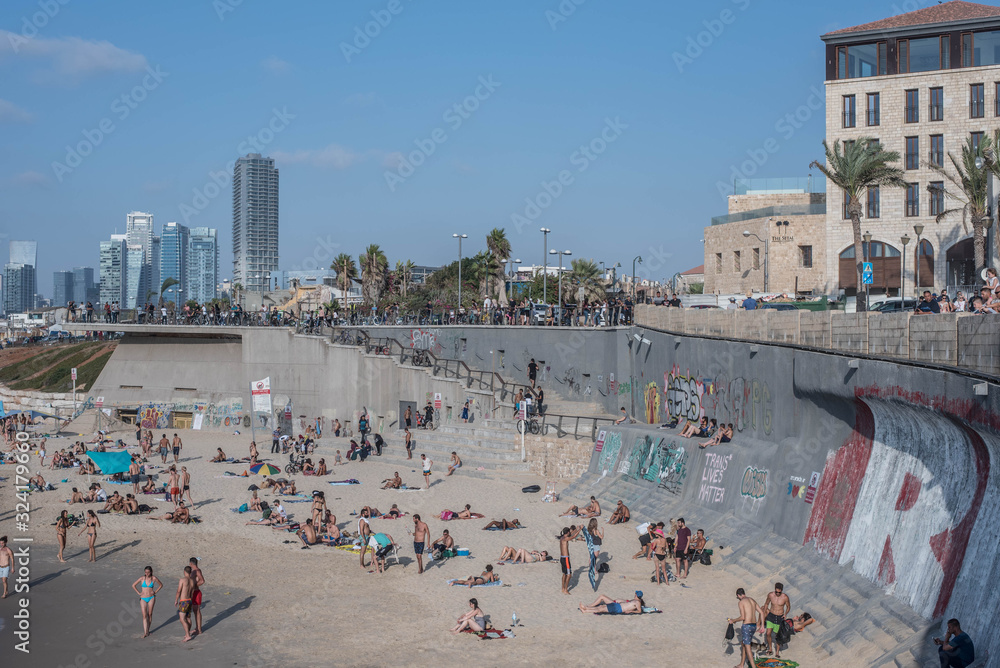 A BEACH IN TEL AVIV ISRAEL FULL OF PEOPLE TOP VIEW