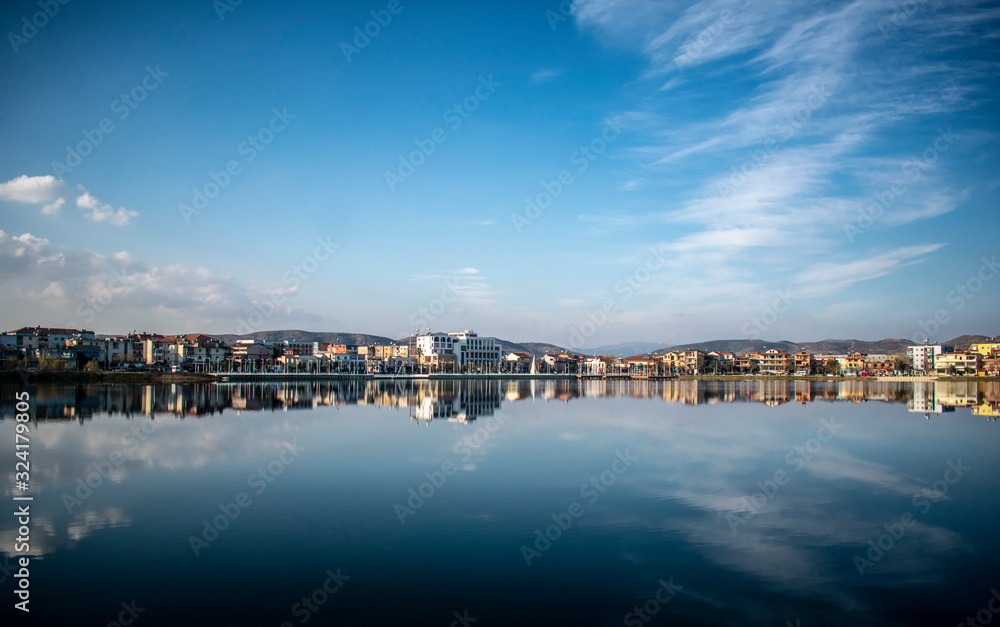 panorama of the city reflected at the lake