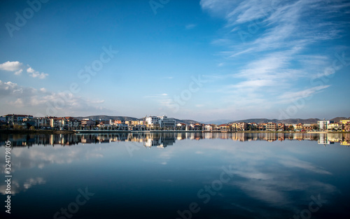 panorama of the city reflected at the lake