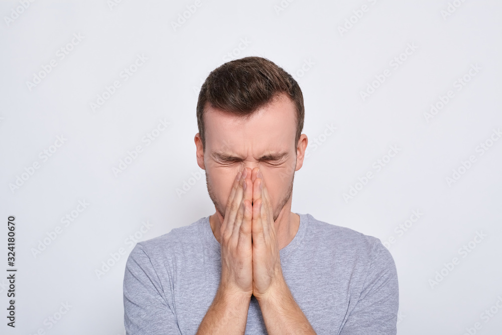The man covered his face. The man covered his face.