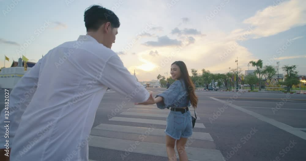 Sweet couple have romantic time while honeymoon trip in Bangkok city Thailand. Young Asian couple running and playing while travelling in slow motion. Sweet couple have romantic time while honeymoon trip in Bangkok city Thailand. Young Asian couple running and playing while travelling in slow motion.