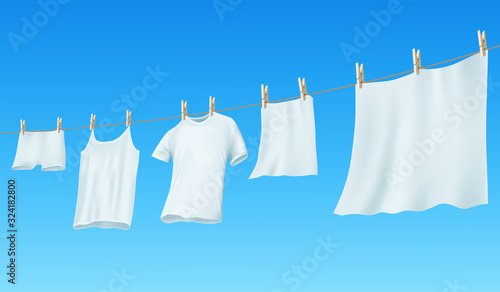 White clean linen and clothes hanging on a rope