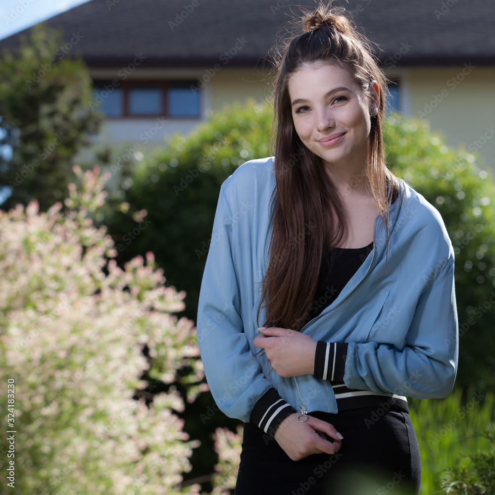 Portrait of beautiful young girl in summer garden. Portrait of beautiful young girl in summer garden.