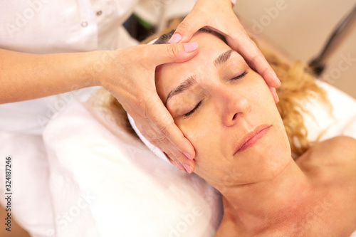 Facial skin beauty treatment followed with massage