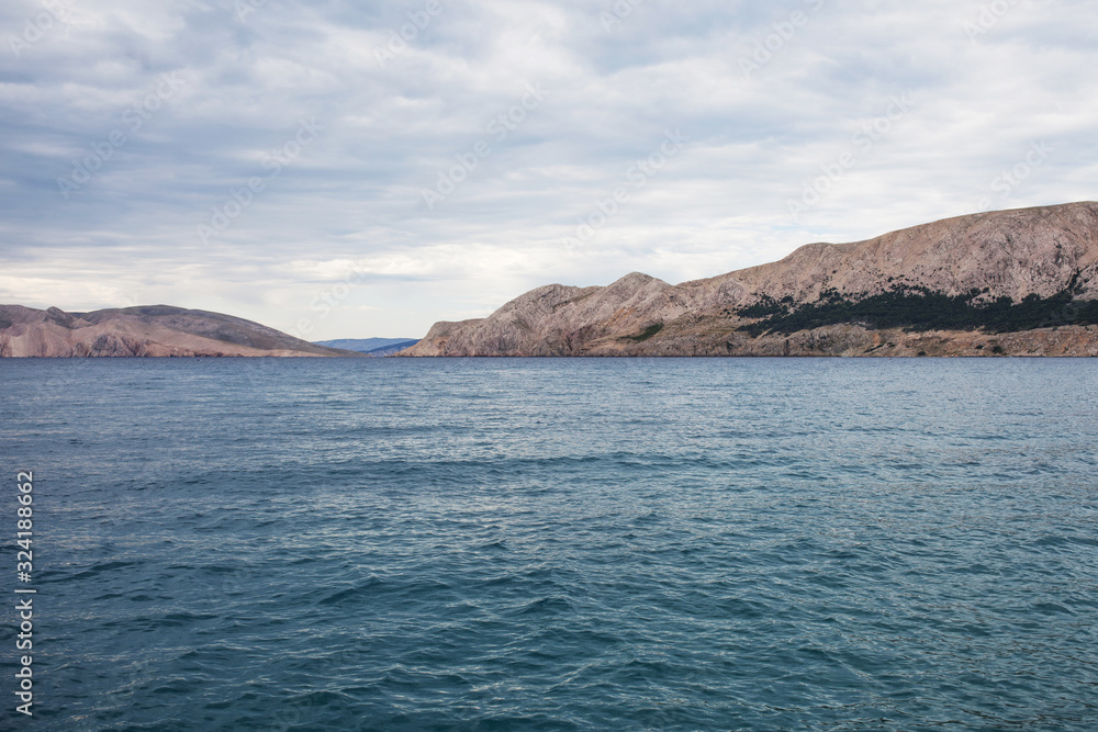 View of the sea and  mountains  cloudy weather. Greatness and tranquility of the landscape