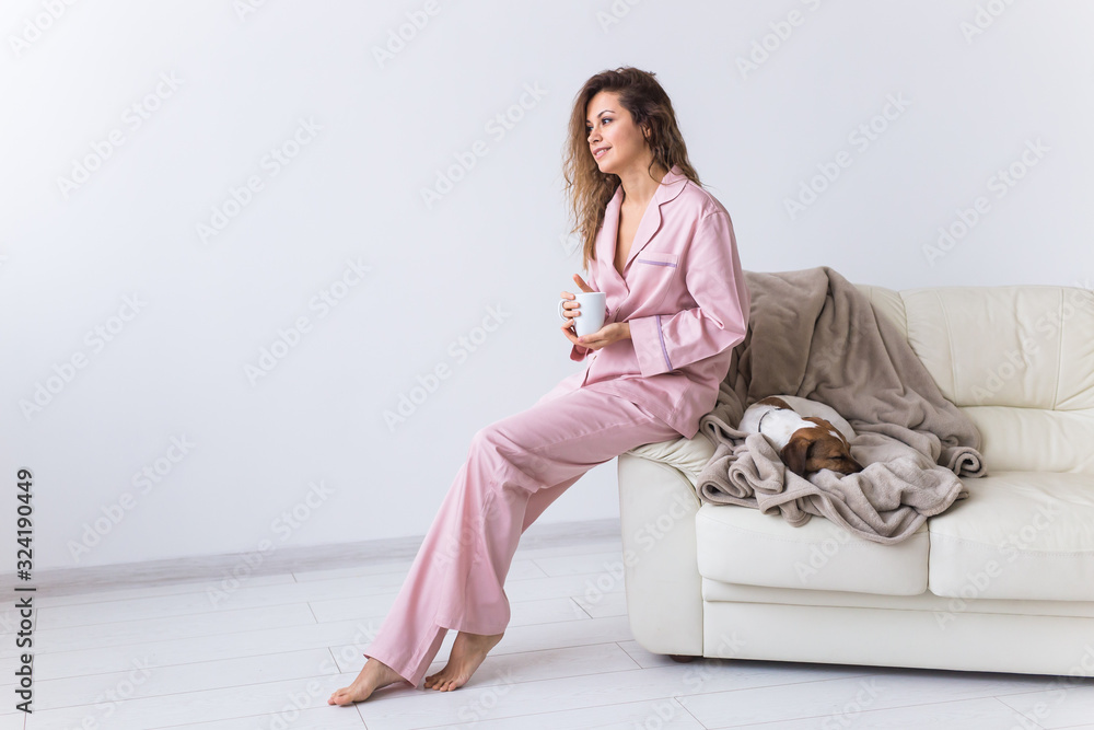 Glamorous girl with happy smile in good morning. Positive female model drinking hot tea Glamorous girl with happy smile in good morning. Positive female model drinking hot tea
