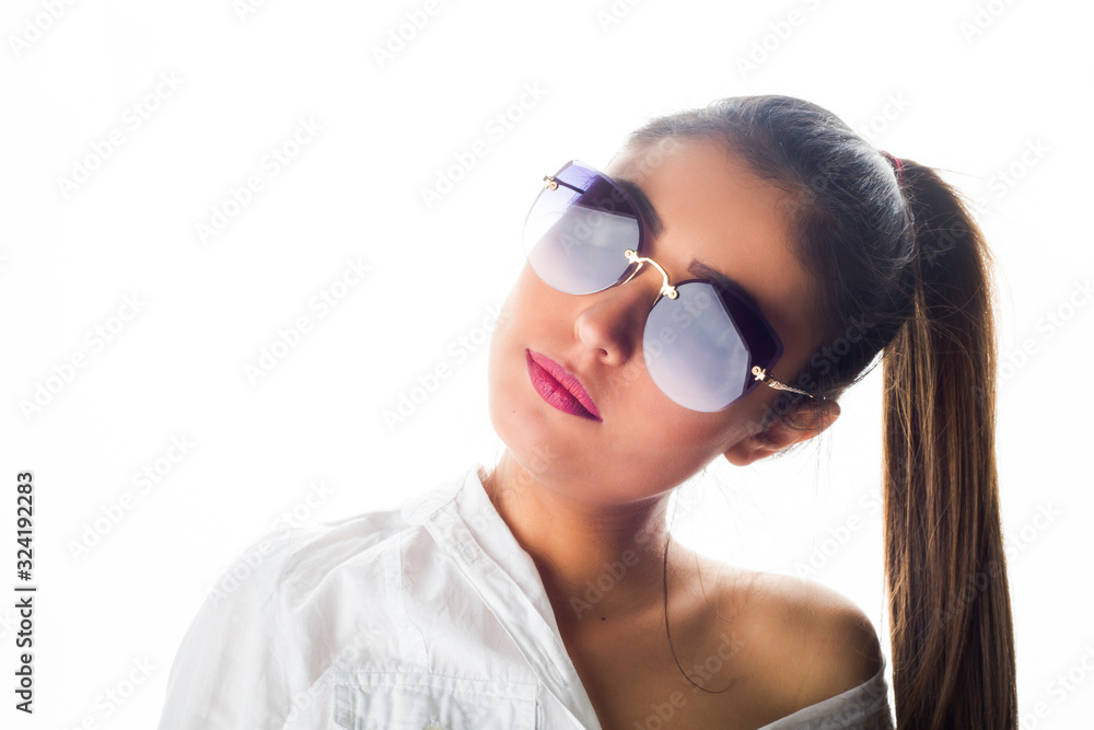 Close up portrait of young beautiful girl posing in sunglasses Close up portrait of young beautiful girl posing in sunglasses