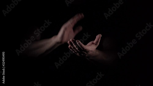 Caucasian male hands demonstrates slow applause gesture on black background isolated 4K