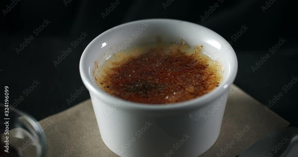 Close up of burnt sugar, caramel cover of creme brulee French dessert Close up of burnt sugar, caramel cover of creme brulee French dessert