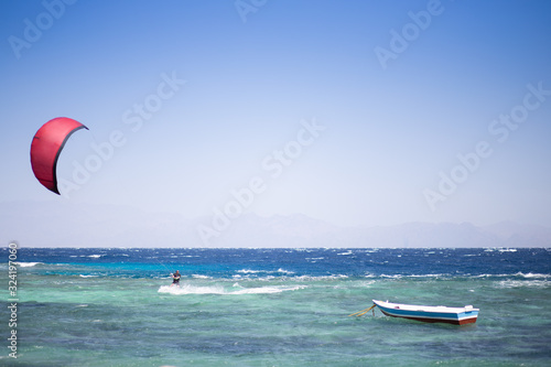 Man kitesurfing in the Red sea in Dahab