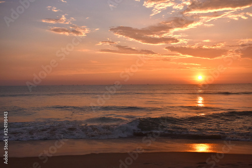 sunset in a sea with beautiful clouds and colorful sky